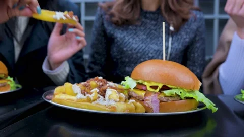 Close-up gourmet freah burger dish on table with french fries. Stock Footage 166301978