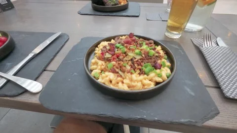 Close-Up of Gourmet Macaroni and Cheese Served on Slate at Modern Restaurant Stock Footage 345687502