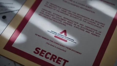 Close up on government manila folder with sensitive top secret information Stock Footage 316317683