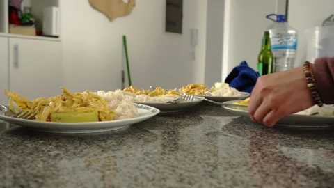 Close-up grabbing plates of aji de pollo, rice with eggs and parboiled potatoes 스톡 동영상 189106636