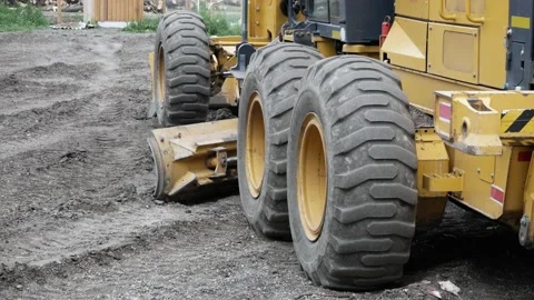 Close-up grader tractor wheel on construction site. Russia, Stavropol, 10.06.20 Stock Footage 144243177