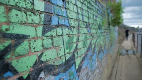 Close up Graffiti on a Canal side Wall Stock Footage 115330207