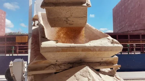 Close up grain elevator in port. Grain wheat loading to bulker ship cargo hold Stock Footage 275076037