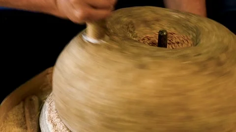 Close-up of the grain grinding process using an antique hand mill with ston.. Vídeos de archivo 328830745