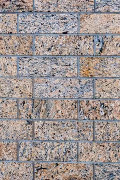 Close up of a granite brick-wall - Image Stock Photos