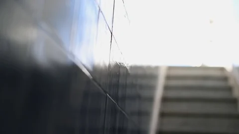 Close-up granite gray staircase steps and shiny tile walls Stock Footage 130116017