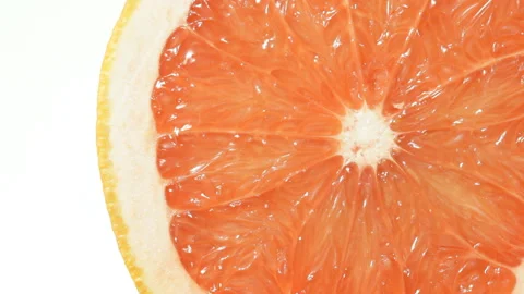 Close up of Grapefruit with falling water drops Stock Footage 89802808