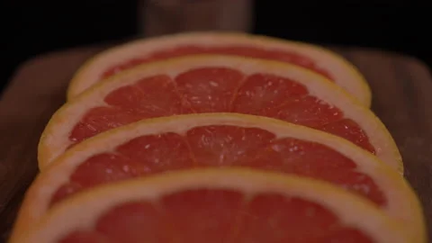 Close up of Grapefruit Slice Panning Down 스톡 동영상 130913065