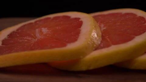 Close up of Grapefruit Slices Panning to the Right 4K 스톡 동영상 130919593