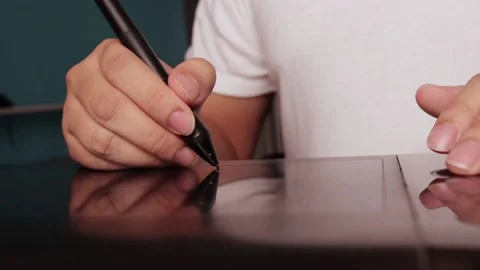 Close up of graphic designer working with pen tablet Stock Footage 143257996