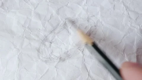 Close up of graphite pencil drawing on textured paper. slow motion footage Stock Footage 340910446