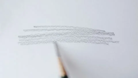 Close up of graphite pencil drawing on textured paper. slow motion footage Stock Footage 340910522