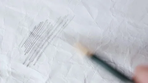 Close up of graphite pencil drawing on textured paper. slow motion footage Stock Footage 340910899