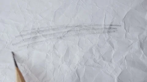 Close up of graphite pencil drawing on textured paper. slow motion footage Stock Footage 340911518