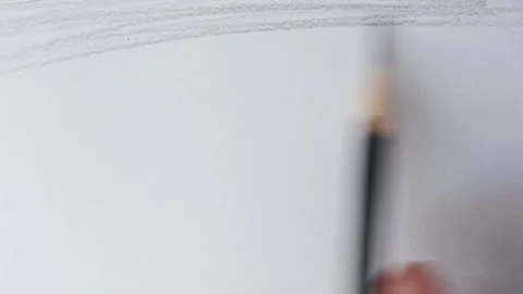 Close up of graphite pencil drawing on textured paper. slow motion footage Stock Footage 340911694