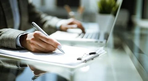 Close-up of graphs and charts analyzed by businesswoman. Foto stock