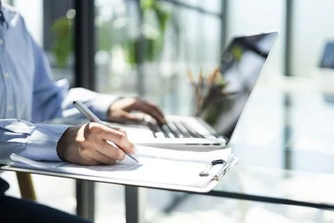 Close-up of graphs and charts analyzed by businesswoman. Stock Photos
