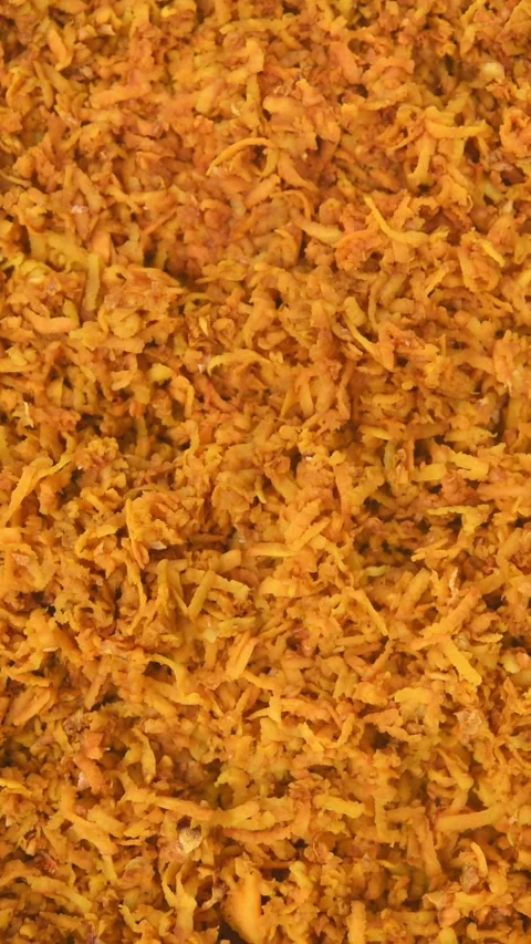 Close-up of grated turmeric pieces for drying Stock Footage 294960314