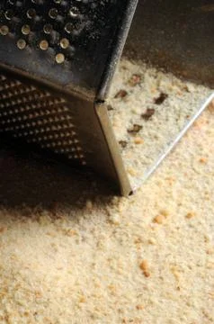 Close up on grater with breadcrumbs Stock Photos