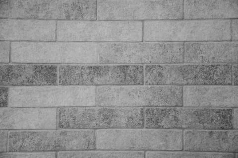 Close-up gray brick wall with copy space. White grunge brick wall background. Stock Photos