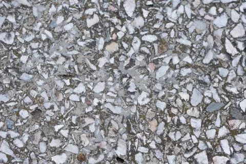 Close-up - gray-brown stone wall in the old facade of the house Stock Photos
