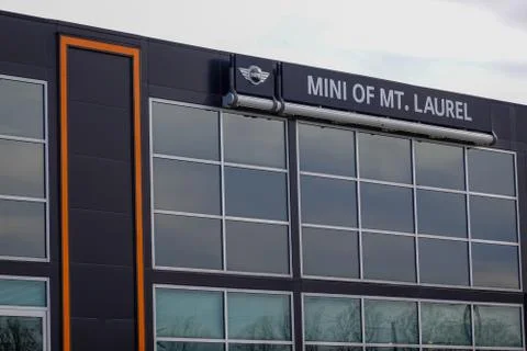 Close up of a gray building with large windows Stock Photos