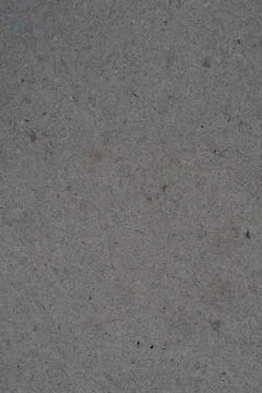 Close-up of gray concrete texture with small black spots Stock Photos