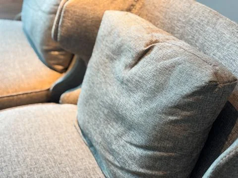 Close-up of Gray Fabric Sofa with Comfortable Pillow in Modern Interior Stock Photos