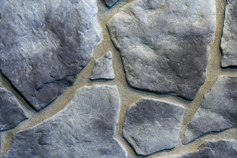 Close-Up of Gray Fieldstone Wall Texture with Irregular Natural Stone Pattern Stock Photos