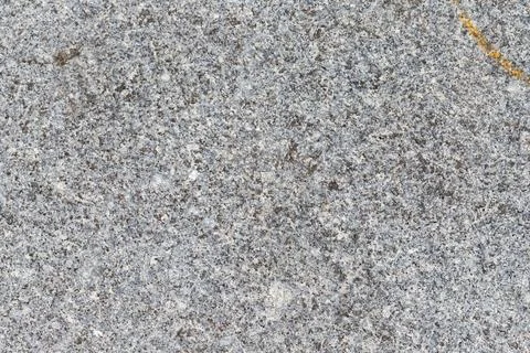 Close-up of Gray Granite Surface with Orange Streak Stock Photos