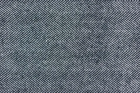 Close-Up of a gray herringbone fabric pattern for background pur Stock Photos