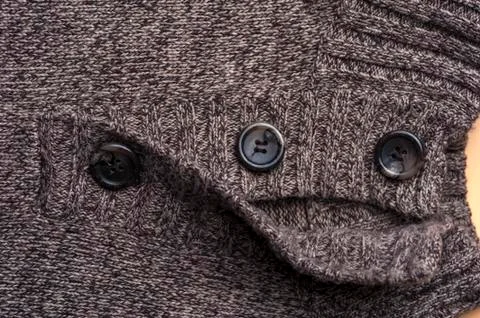 Close-up of a gray knitted warm jacket Stock Photos