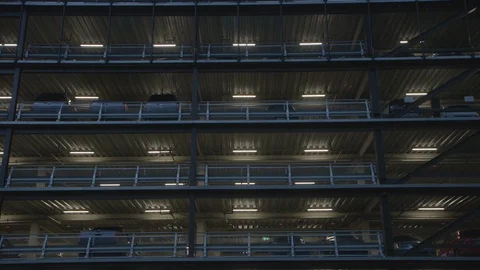 Close up of gray moody Multilevel carpark with lights on. 動画素材 127413581