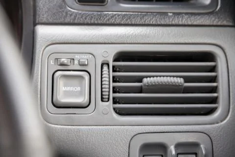 Close-up of a gray plastic panel with buttons and a toggle switch for automat 写真素材