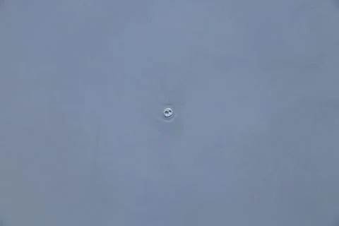 Close-up of gray plastic with smooth surface and alloy place in the center .. Stock Photos