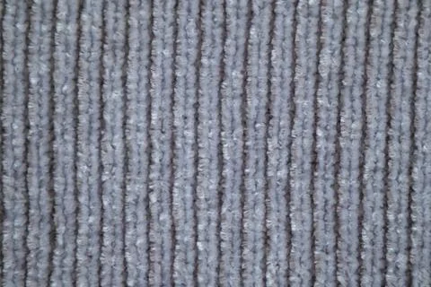 Close-up of gray ribbed carpet texture with vertical loop pile for background 库存照片
