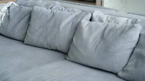 Close-up of a gray sofa with pillows Stock Footage 285576320