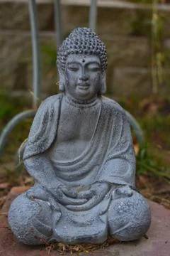 Close up of a gray stone Budda statue Stock Photos