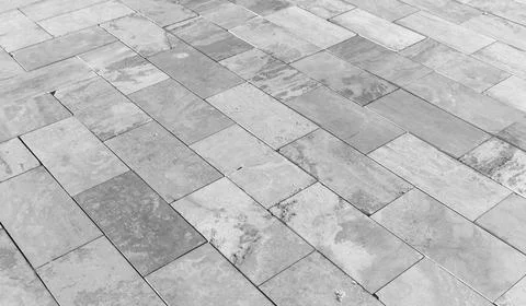 Close-up of gray stone tile flooring, black and white Stock Photos