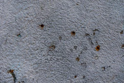 Close-up - gray stone wall in the old facade of the house Stock Photos