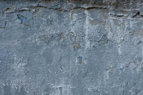 Close-up - gray stone wall in the old facade of the house Stock Photos