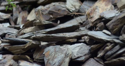 Close-up of gray stones falling down of mountain rocks in slow motion Stock Footage 96646784