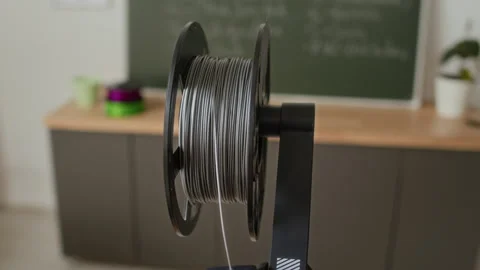 Close up of Gray Thread Leading Into 3D Printer in Modern Classroom Stock Footage 335689232