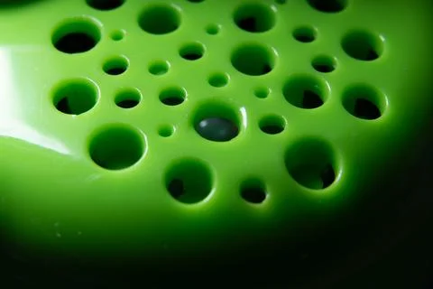 Close Up Green Abstract Texture Pattern of Round Holes and Light Shadow for.. Foto stock