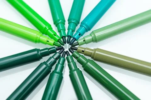 Close up of green colored felt-tip pens on isolated background. Selective foc Stock Photos