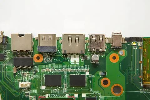 Close-up of a green computer circuit board with chips Stock Photos