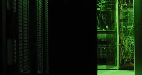 Close up of green control lights on computer servers in tech room 動画素材 344643601