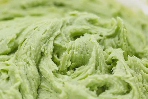 Close up on green cookie dough. Spring holidays cooking concept. Stock Photos