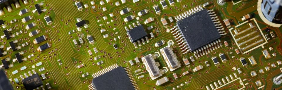 Close-up of a green electronic computer board with microchips Stock Photos