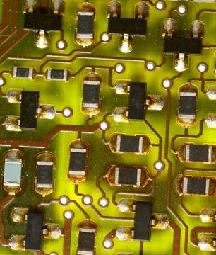Close-up of a green electronic computer board with microchips Stock Photos